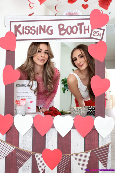 Teen charmers Renee Rose and Penelope Kay seduce a boy at a kissing booth Image #2