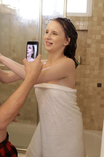 Naked teen Lily Moon gets jizz on her face after being caught showering Image #5