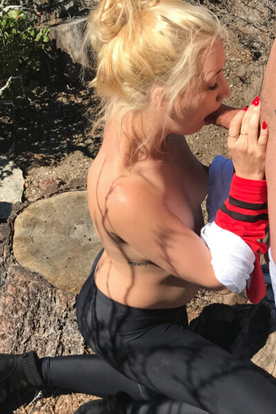 Blonde teen goes topless while sucking off a cock near a tree stump Image #4