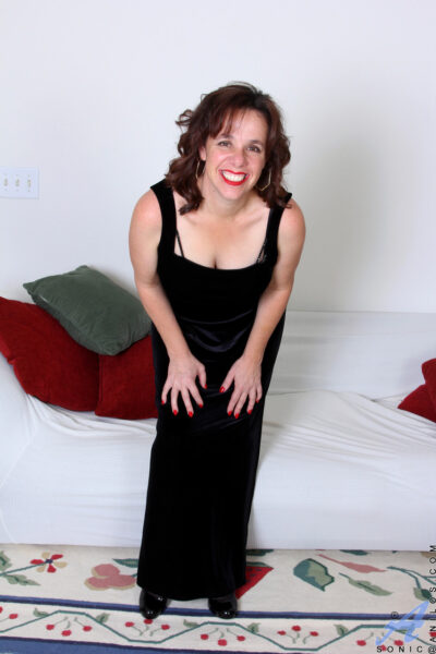 Sexy MILF Sonic doffs her black dress & stockings & spreads her shaved pussy Image #2