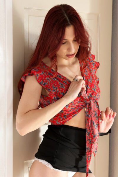 Sexy redhead April Snow has sexual intercourse with her stepson on a couch Image #1