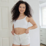 Cute teen Thalia Diaz sports curly hair during a POV fuck on a bed