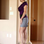 Sexy cougar Jenny Mason flaunts her fake juggs and clit through hot panties