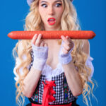Young girl with long wavy blonde hair Kenzie Reeves has sex in a funky hat