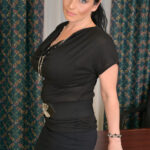 Busty Canadian MILF with ponytail Stacy Ray strips and rubs her beaver