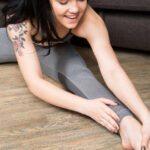 Inked Russian babe Tetti Dew Korti strips & masturbates during her workout