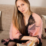 First timer Lea highlights her shaved vagina on a sofa in stockings