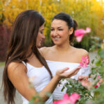 Lesbian girls Alexi Star & Suzy Rainbow pause to smell the flowers before sex