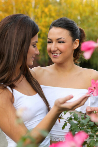 Lesbian girls Alexi Star & Suzy Rainbow pause to smell the flowers before sex Image #1