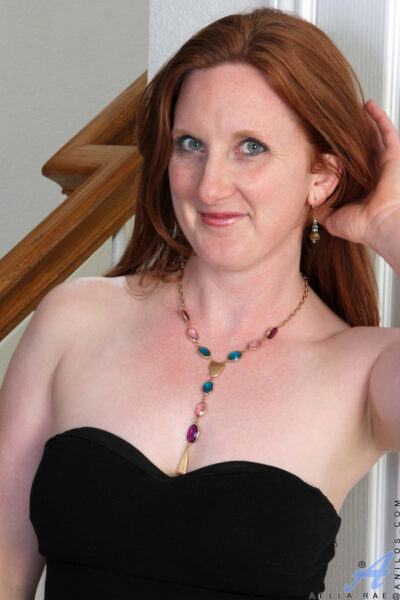 Natural redhead Aella Rae discards a black dress for her first nude session Image #1