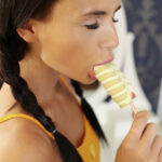 Petite Russian teen Kate Rich feeds herself with a popsicle and a thick penis