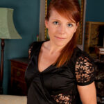 Redheaded British MILF Kay C spreading her tasty pussy in stockings