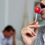 Brunette teen Anie Darling licks a sucker while seducing her stepdad