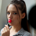 Brunette teen Anie Darling licks a sucker while seducing her stepdad