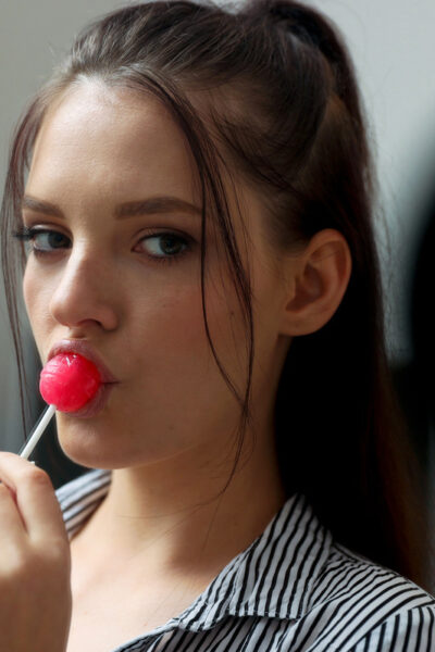 Brunette teen Anie Darling licks a sucker while seducing her stepdad Image #1